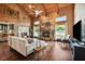 Comfortable living room with stone fireplace, wood paneled walls and a view to the waterfront at 1531 75Th Ne Cir, St Petersburg, FL 33702