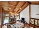 Spacious living room with high ceilings, stone fireplace, and wood accents for a warm and inviting atmosphere at 1531 75Th Ne Cir, St Petersburg, FL 33702