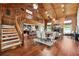 Cozy living room with vaulted ceilings, stone fireplace, hardwood floors and views to the kitchen at 1531 75Th Ne Cir, St Petersburg, FL 33702