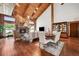 Comfortable living room with a stone fireplace and hardwood floors creates a cozy and inviting living space at 1531 75Th Ne Cir, St Petersburg, FL 33702