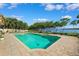 Backyard pool overlooking the water with mature landscaping at 1531 75Th Ne Cir, St Petersburg, FL 33702