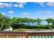 Scenic view of a lake with trees and a dock at 1531 75Th Ne Cir, St Petersburg, FL 33702