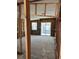Interior view with exposed framing, a sliding glass door, and a window at 15416 2Nd E St, Madeira Beach, FL 33708
