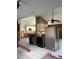 Interior view of a kitchen with appliances, showing renovation work in progress on the walls and floor at 15416 2Nd E St, Madeira Beach, FL 33708