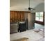 Image of a kitchen with appliances and window, showing renovation work in progress on the walls and floor at 15416 2Nd E St, Madeira Beach, FL 33708