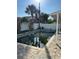 Backyard pool surrounded by brick pavers, overlooked by the covered rear patio of the home at 15416 2Nd E St, Madeira Beach, FL 33708