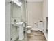 Clean bathroom featuring a glass shower, pedestal sink, and modern fixtures at 1669 Feather Grass Loop, Lutz, FL 33558