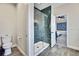 Modern bathroom featuring a sleek glass-enclosed shower and toilet, offering a functional and stylish space at 1669 Feather Grass Loop, Lutz, FL 33558