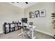 Bright bedroom with desk, organized shelving, natural light and comfortable decor at 1669 Feather Grass Loop, Lutz, FL 33558