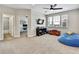 Versatile bonus room featuring neutral colors, ample natural light, and a peek into the attached office at 1669 Feather Grass Loop, Lutz, FL 33558
