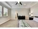 Inviting primary bedroom with walk-in closet, dresser, and access to the ensuite bathroom and closet at 1669 Feather Grass Loop, Lutz, FL 33558