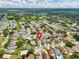 Aerial view of neighborhood, pinpointing home in a well-treed community at 1706 Erin Brooke Dr, Valrico, FL 33594