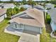Aerial view of single Gathering house featuring a gray roof and gray exterior at 1706 Erin Brooke Dr, Valrico, FL 33594
