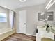 Bathroom featuring double sinks, light countertops, and tub shower at 1706 Erin Brooke Dr, Valrico, FL 33594