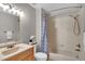 Bathroom with tile, shower and tub combo, and vanity at 1706 Erin Brooke Dr, Valrico, FL 33594