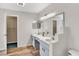 Bathroom with double vanity, large mirrors, and closet at 1706 Erin Brooke Dr, Valrico, FL 33594