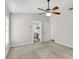 Bedroom with ceiling fan and view to attached bath at 1706 Erin Brooke Dr, Valrico, FL 33594
