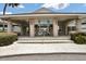 Welcoming clubhouse entrance featuring a covered walkway supported by sturdy columns at 1706 Erin Brooke Dr, Valrico, FL 33594