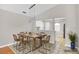 Staged dining room area with tile flooring and a dining table with chairs at 1706 Erin Brooke Dr, Valrico, FL 33594