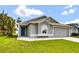 Well-maintained single-Gathering home with a gray exterior and a two-car garage at 1706 Erin Brooke Dr, Valrico, FL 33594