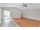 Spacious living room area with wood flooring and access to the outdoors at 1706 Erin Brooke Dr, Valrico, FL 33594