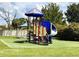 Fun playground featuring a slide, climbing structure, and soft turf at 1706 Erin Brooke Dr, Valrico, FL 33594
