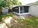 The screen patio overlooks the home's spacious backyard at 2114 Intervista Ln, Valrico, FL 33594