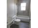 Bathroom featuring a bathtub and shower combo and a classic pedestal sink and vintage faucet at 2114 Intervista Ln, Valrico, FL 33594