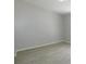 Minimalist bedroom featuring neutral colors and wood-look flooring at 2114 Intervista Ln, Valrico, FL 33594