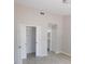 Light filled bedroom with walk-in closet and bathroom access at 2114 Intervista Ln, Valrico, FL 33594