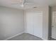 A bedroom featuring wood-look floors and closet at 2114 Intervista Ln, Valrico, FL 33594