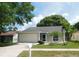 Charming single-story home with a two-car garage, screened entrance, and well-maintained lawn at 2114 Intervista Ln, Valrico, FL 33594