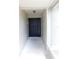 Inviting entryway featuring a modern black front door with sidelight, creating a welcoming entrance at 2114 Intervista Ln, Valrico, FL 33594