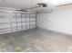 Spacious garage with overhead door and ample room for parking at 2114 Intervista Ln, Valrico, FL 33594