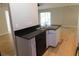 Kitchen with black dishwasher and sink overlooking the living area at 2114 Intervista Ln, Valrico, FL 33594
