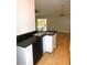 Kitchen with black dishwasher and sink overlooking the living area at 2114 Intervista Ln, Valrico, FL 33594