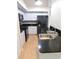 Modern kitchen featuring stainless steel sink and black appliances at 2114 Intervista Ln, Valrico, FL 33594