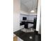 Bright kitchen featuring white cabinets, black appliances, and granite countertops at 2114 Intervista Ln, Valrico, FL 33594
