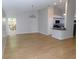 Open-concept living room with hardwood floors, neutral walls, and easy access to the kitchen at 2114 Intervista Ln, Valrico, FL 33594