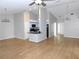 Bright and open living area featuring hardwood floors and seamless integration with the kitchen at 2114 Intervista Ln, Valrico, FL 33594