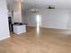 Spacious living area with hardwood floors and an open layout, showcasing seamless kitchen integration at 2114 Intervista Ln, Valrico, FL 33594