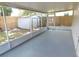 Covered patio offers serene views of the fenced backyard and shed at 2114 Intervista Ln, Valrico, FL 33594
