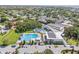 Aerial view of community pool, parking, and other neighborhood amenities and buildings at 2320 Harn Blvd, Clearwater, FL 33764