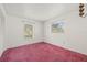 Bedroom with two windows and a closet at 2320 Harn Blvd, Clearwater, FL 33764