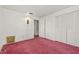 Bedroom featuring a closet and a view to the hallway at 2320 Harn Blvd, Clearwater, FL 33764