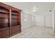 Versatile room with tile flooring and built-in shelving and cabinets at 2320 Harn Blvd, Clearwater, FL 33764