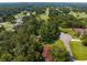 Expansive aerial view of a home nestled amidst lush greenery and a golf course, offering a serene retreat at 23327 Christian Cir, Brooksville, FL 34601