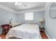 Bright bedroom with a classic bed, soft lighting, and clean, simple decor at 23327 Christian Cir, Brooksville, FL 34601
