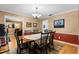 Charming dining room with a lovely chandelier and comfortable seating for six at 23327 Christian Cir, Brooksville, FL 34601