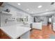 Bright, updated kitchen featuring white cabinets, modern appliances, and tile flooring at 23327 Christian Cir, Brooksville, FL 34601